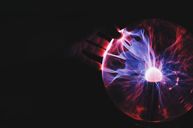 A hand touching a crystal ball